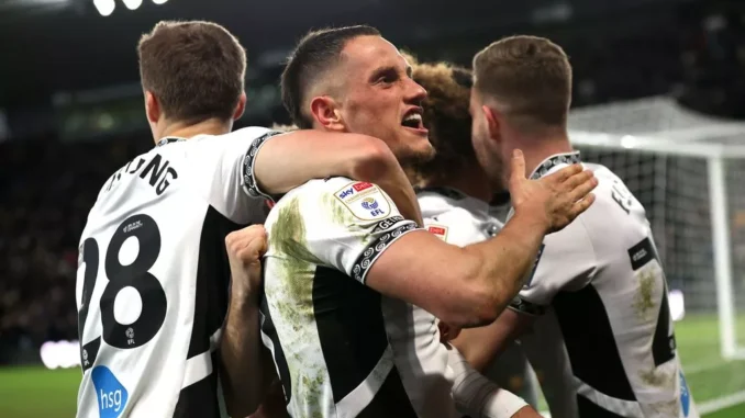 1_Derby-Countys-Jerry-Yates-celebrates-their-sides-second-goal-of-the-game-scored-by-team-mate-Marcus-Harness-hidden